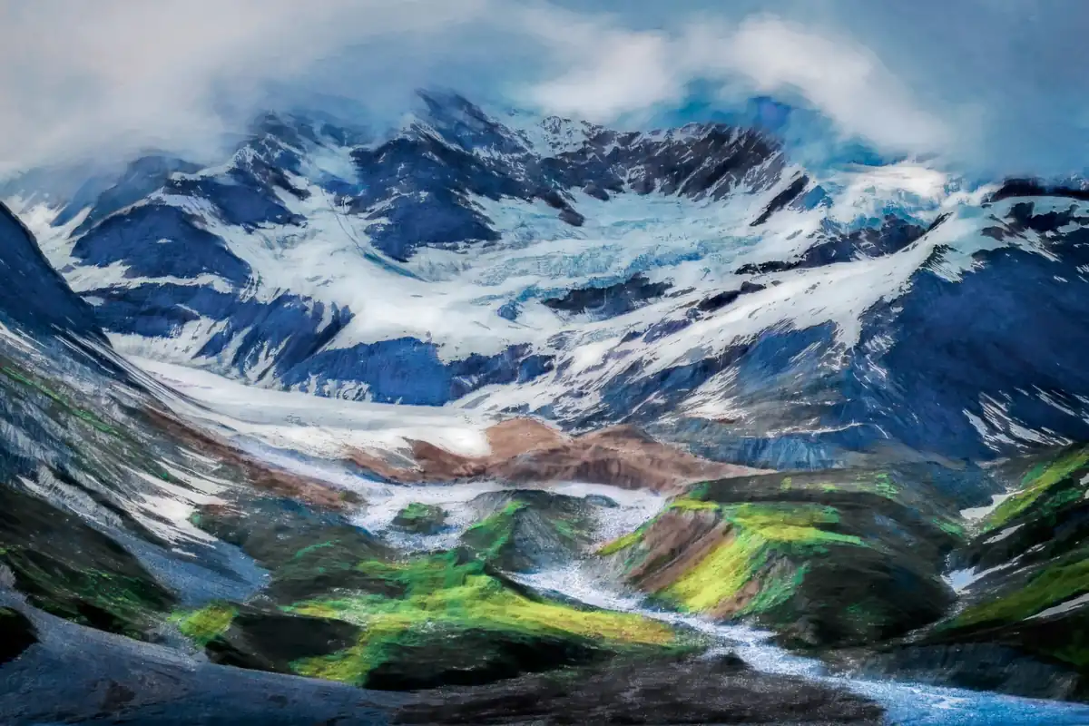 Glacial ice descending through dark mountains toward green earth